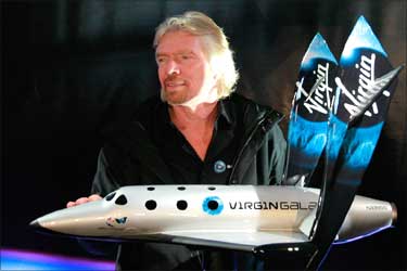Richard Branson with model of SpaceShipTwo.