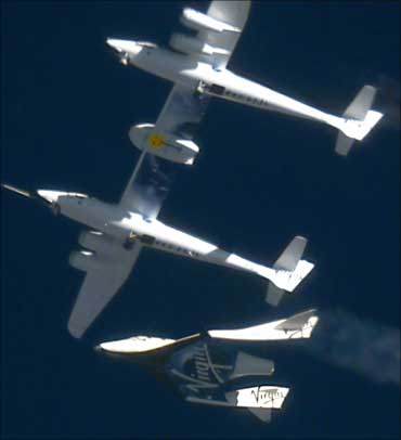 The Virgin Galactic SpaceShip2 (VSS Enterprise) (bottom) is released at 46,000 feet (14,020 meters) from the WhiteKnight2 (VMS Eve) mothership (top), over Mojave, California October 10, 2010.