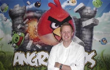 Mikael Hed, chief executive of Rovio, known for its Angry Birds game, stands in front of an Angry Birds.