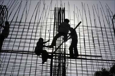 Labourers work at a riverfront construction site near the Sabarmati river in Ahmedabad.