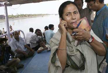 Railway Minister Mamata Banerjee speaks on a mobile phone.