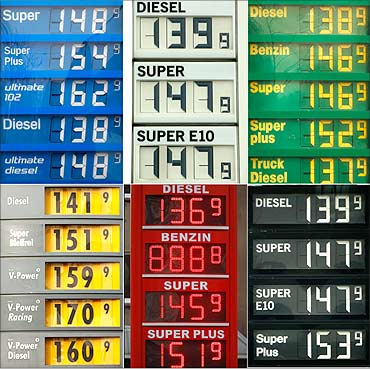 A combination picture shows price boards at various petrol stations in Dortmund, February 24, 2011.