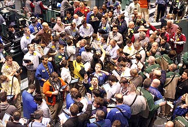 Traders work in the oil options pit on the floor of the New York Mercantile Exchange in New York City.