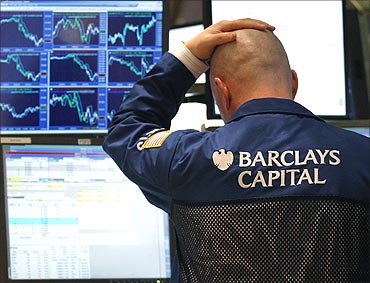 A traders watches his screen on the floor of the New York Stock Exchange.