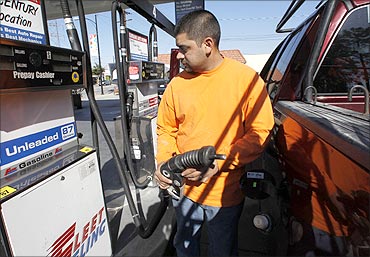 Raul Martinez pumps gas into his employer's truck at Fleet Fueling in Burbank, California.