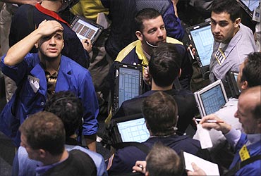 Traders work in the oil options pit on the floor of the New York Mercantile Exchange in New York City.
