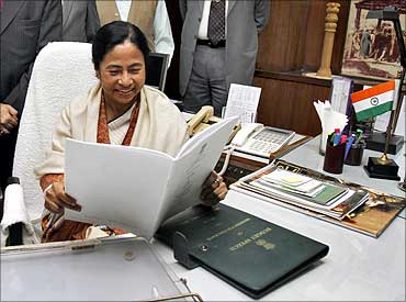 Railways Minister Mamata Banerjee smiles before giving the final touches to the Rail Budget.