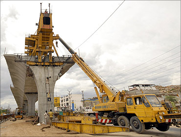 Labourers work at a flyover undergoing construction in the southern Indian city of Hyderabad.