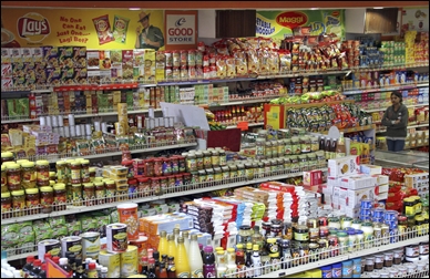 A customer shops inside a grocery store in Lucknow.