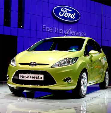 A new Ford Fiesta car is displayed.