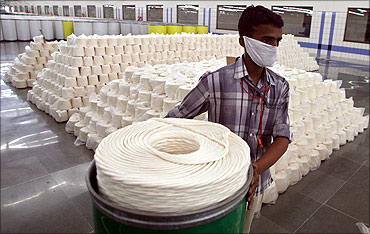 An employee works inside a textile mill in Jhagadia village of Gujarat.