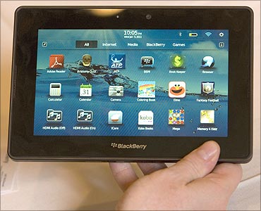 Jeff McDowell, senior vice president Research in Motion, holds a prototype Blackberry PlayBook.