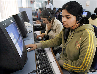 Employees at a call centre provide service support to customers at Siliguri, West Bengal.