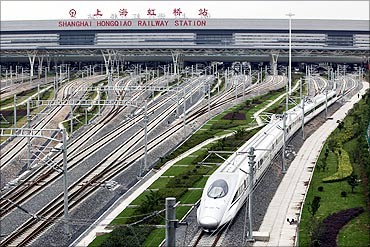 A high-speed train travels on the newly built Shanghai-Hangzhou railway in Shanghai