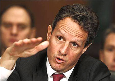 Secretary of Treasury Timothy Geithner gestures at the Senate Finance Committee.