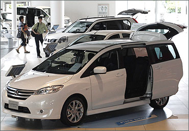 People look at cars from Nissan Motor.