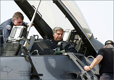 Ratan Tata sits inside the cockpit of the U.S. F-16 aircraft during the 'Aero India 2007' air show.