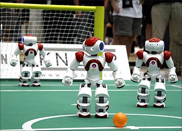Humanoid robots compete in a soccer match the RoboCup 2009 in Graz.