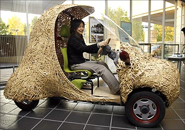 Bamgoo, an electric car with a body made out of bamboo, is displayed in Kyoto.