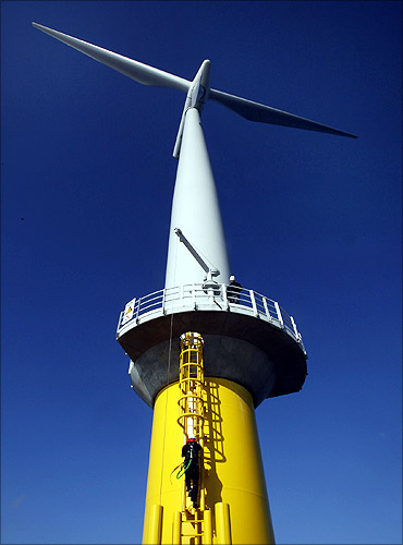A worker climbs the ladder to a windmill at Horns Rev 2, the world's largest wind farm.