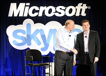 Microsoft CEO Steve Ballmer (L) and Skype CEO Tony Bates.