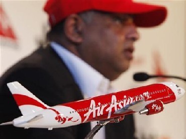 Air Asia CEO Tony Fernandes answers a question during a news conference