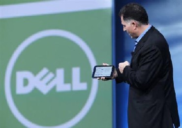 Dell founder and CEO Michael Dell displays a Dell tablet computer