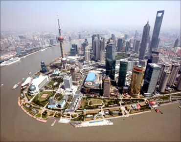 An aerial view shows Shanghai's new financial district skyline along the Huang Pu river in Shanghai.