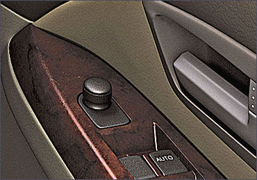 Maruti SX4 driver's side inside door control interior.
