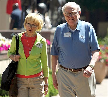 Berkshire Hathaway chairman and CEO Warren Buffett (R) and his wife Astrid Buffet.