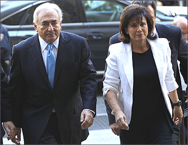 Strauss-Kahn and his wife Anne Sinclair arrive for a hearing at the New York State Supreme Courthouse.