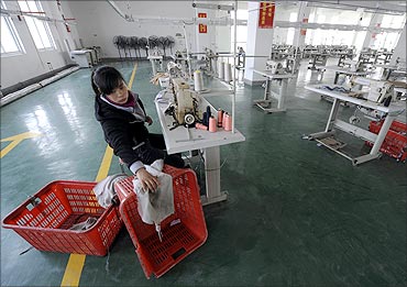 An employee works at a garment factory of Hefei Shichao Clothing Co in Hefei, Anhui province.