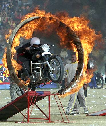 An Indian policeman performs a stunt during the Republic Day celebrations in Jammu.