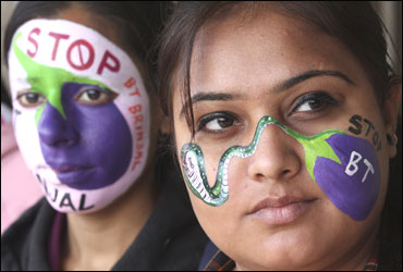 Students from the department of environment studies pose with their painted faces during a protest in Chandigarh.