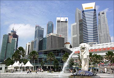 The Singapore Merlion is seen in front of the city centre.