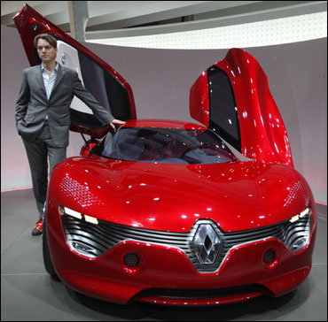 Laurens van den Acker, Renault's design director, poses next to Dezir.