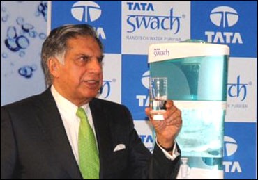 Ratan Tata posing with Swach, the low-cost water filter