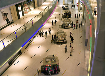 Shoppers move in the mall.