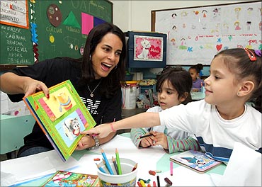 Cristina Andrade helps students in Rio de Janerio, Brazil.