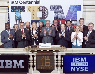 IBM Chairman and CEO Samuel Palmisano (center) and IBM executives ring The Opening Bell at the NYSE.