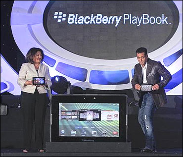 Frenny Bawa, MD of Research In Motion (RIM) India and Salman Khan (R) unveil the PlayBook.