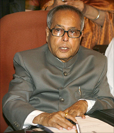Pranab Mukherjee sits before giving the final touches to the Budget in New Delhi.