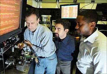 IBM scientists (L to R) Yurii Vlasov, William Green, S Assefa unveiled a new CMOS Integrated Silicon Nanophotonics chip technology.