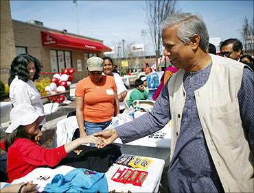 Muhammad Yunus greets borrowers at a Grameen America open house at St John's University in New York.