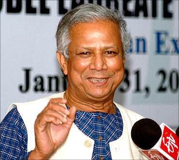 Muhammad Yunus addresses a press conference in New Delhi.