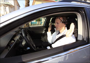 Daniel Goehring of AutoNOMOS research team at the Freie Universitaet demonstrates hands-free driving of the research car named 'MadeInGermany'.