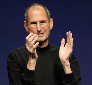 Jobs applauds at the conclusion of the launch of the iPad 2 on March 2, 2011.