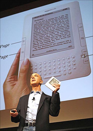 Amazon CEO Jeff Bezos with the Kindle.