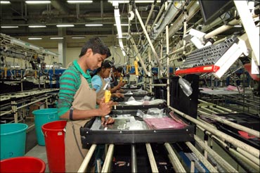 Rural Indians working at the Dell assembly line.