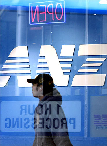 A pedestrian walks past an ANZ bank branch in Melbourne.
